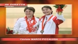 10/08/2008 - Pechino,abbraccio di pace sul podio