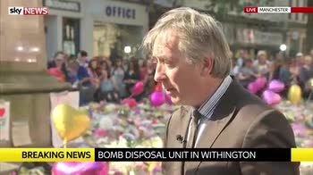 Police search houses in Wigan and Manchester