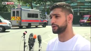 Boxer Amir Khan visits Grenfell victims