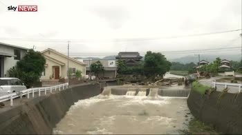 Japan floods wash away homes and vehicles