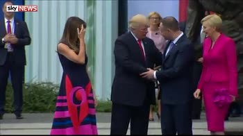 Melania first: Trump's Poland handshake mishap