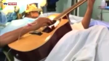 Brain surgery patient plays guitar during op