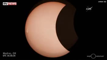 NASA footage of orange sun during eclipse