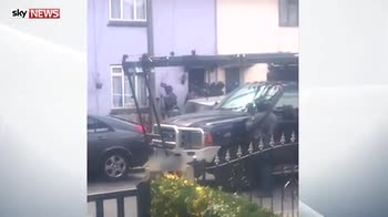 Moment armed police entered Surrey house