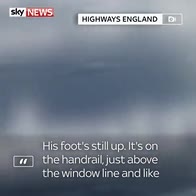 Truck driver filmed with foot on dashboard
