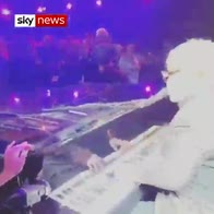 Ouch: Elton John hit by flying necklace