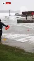 Swimmer rescued from rough sea