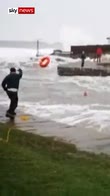 Swimmer rescued from rough sea