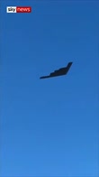 Stealth bomber flies over cop funeral
