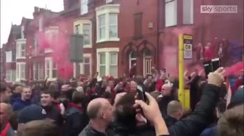 Liverpool fans welcome their team's bus