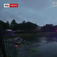 Police smash car window in lake rescue