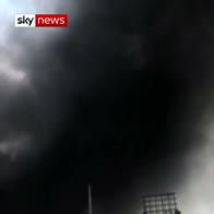 Warehouse fire blocks China sky