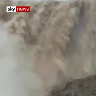 Oman waterfall overflows after cyclone