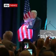 Trump gives US flag a big hug