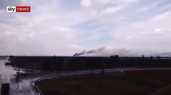 Smoke rises from plane crash site