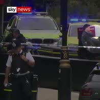 Westminster crash: Handcuffed man led away