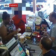 Woman throws coffee over shop counter