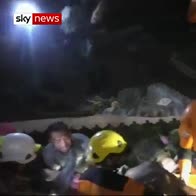 Woman pulled alive from quake rubble