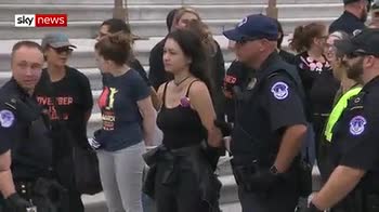 Protesters cuffed with hand ties