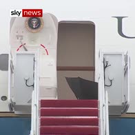 Trump casually discards umbrella at door