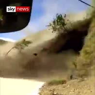 Terrifying moment landslide hits bus