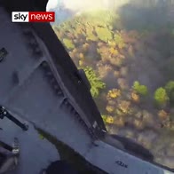 Helicopter drops water on Camp Fire