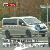 Protesters jump on car in France