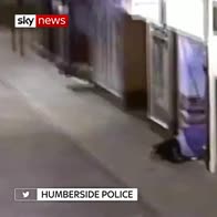 CCTV shows man jump on homeless tent in doorway