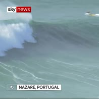 Giant waves attract surfers in Portugal