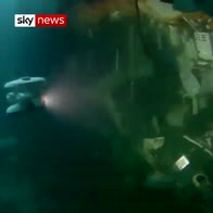 Divers prepare sunken frigate to be lifted