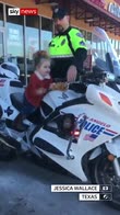 Curious little girl tries Texas cop's bike
