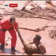 Helicopters plucks people from Brazil mud