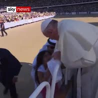 Girl sneaks through security to see Pope