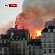 Notre-Dame spire topples during blaze