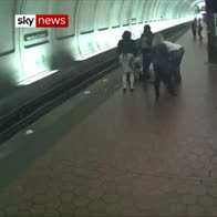 Moment blind man falls onto tube tracks