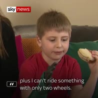 Boy with bionic arm enjoys burger on live TV