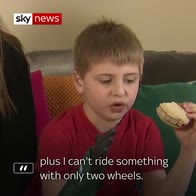 Boy with bionic arm enjoys burger on live TV