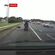 Mobility scooter races motorway traffic