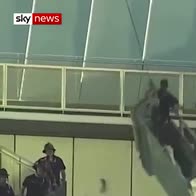 Men rescued from dangling 850ft-high platform