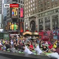 Hundreds limber up for yoga in Times Square