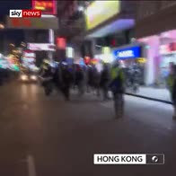 Riot police push along Hong Kong street