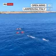 Migrants attempt to swim to shore in Italy