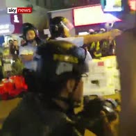 Hong Kong police point handguns at protesters