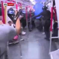Hong Kong riot police storm metro