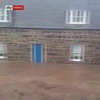 Homes submerged as flash floods hit UK