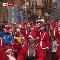 Thousands dress as Santa for charity run
